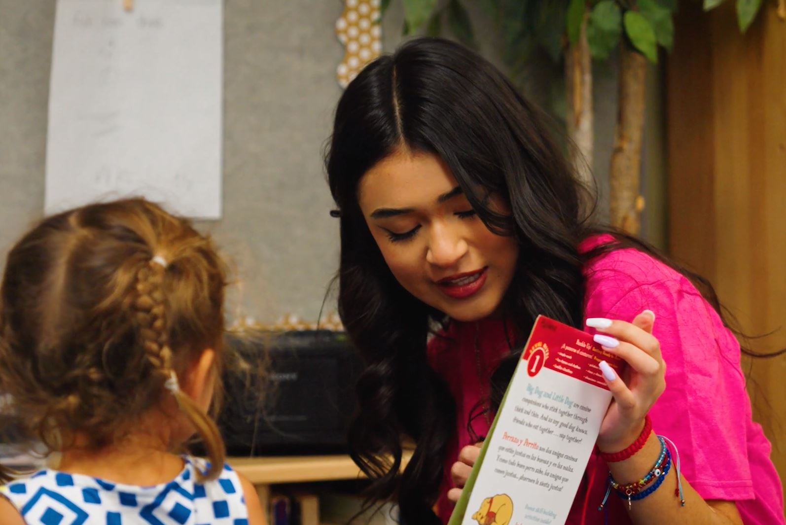 teacher teaching her student