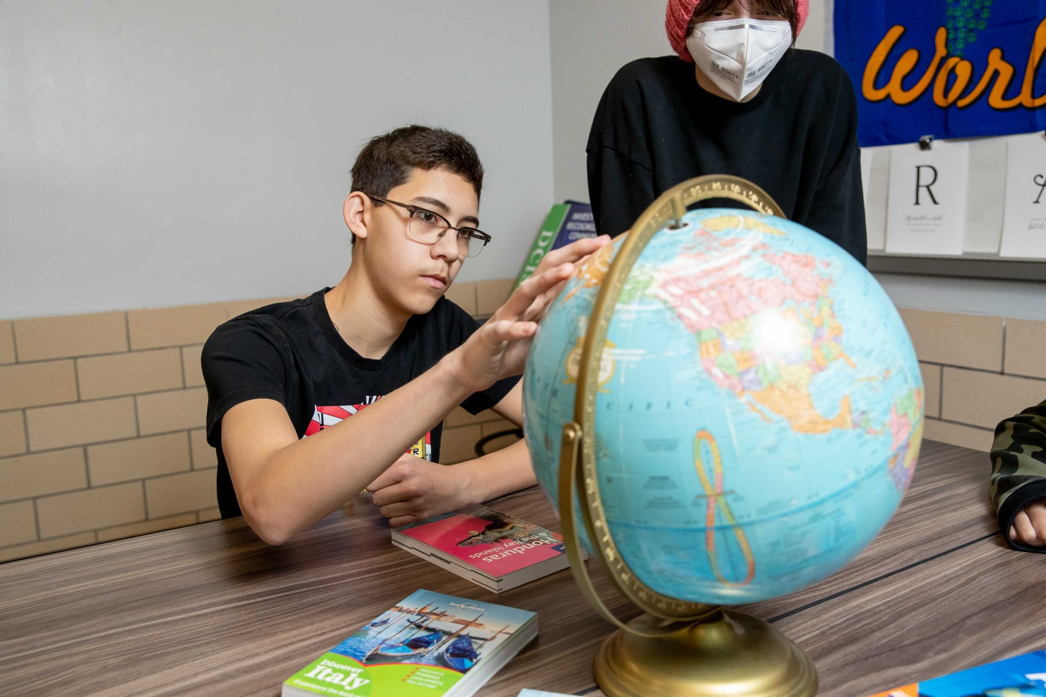 student with globe