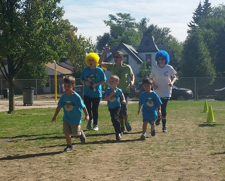 Eagle run students and teachers running