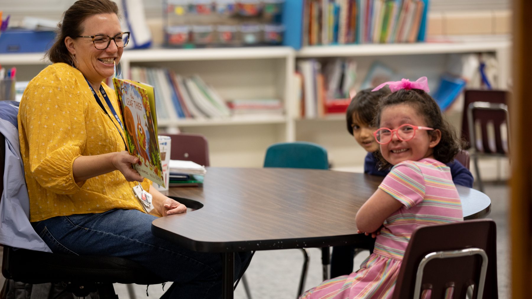 Student and teacher sitting at a table