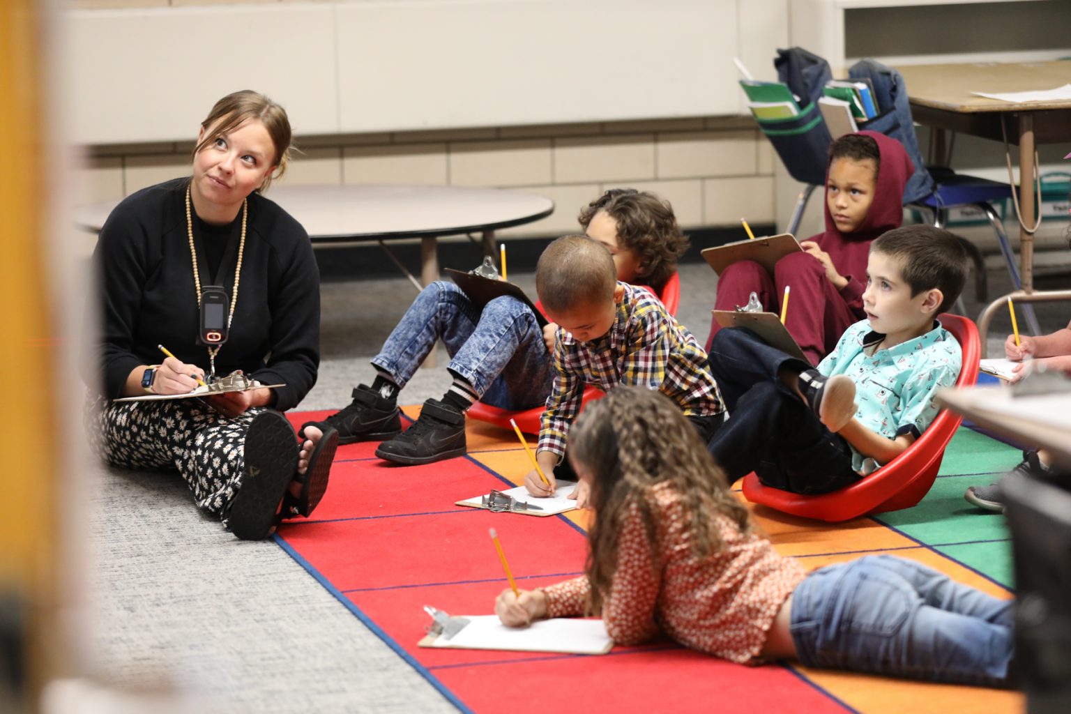 Students working on the classroom floor