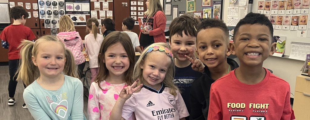 group of students smiling to camera