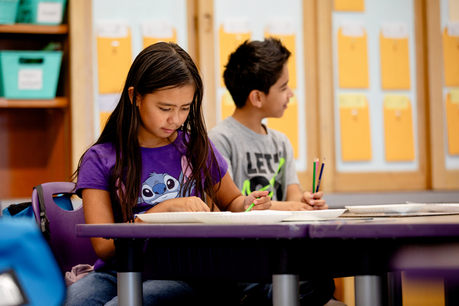 Students at her desk