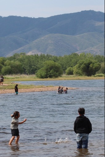 Kids playing on a river