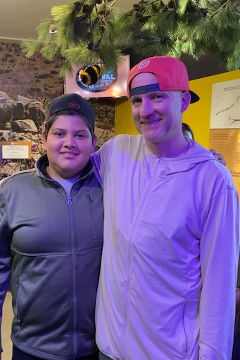 Teacher and teen student smiling posing for photo