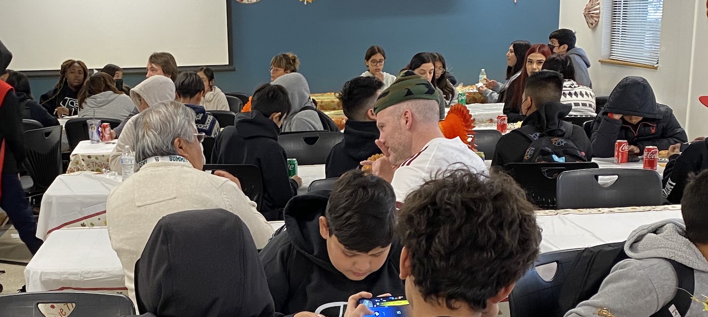 Families and student reunited at a classroom