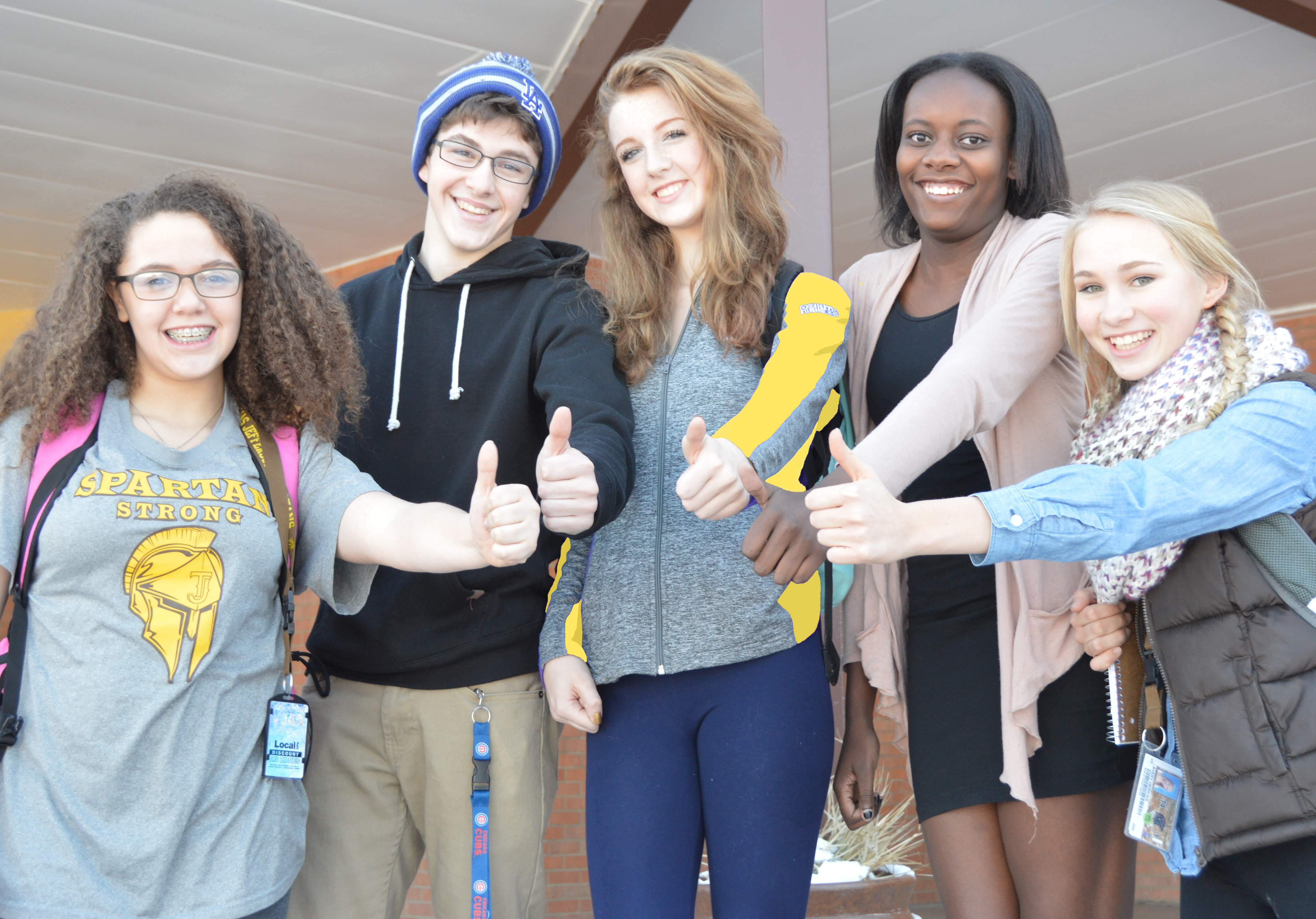 5 students with thumbs up