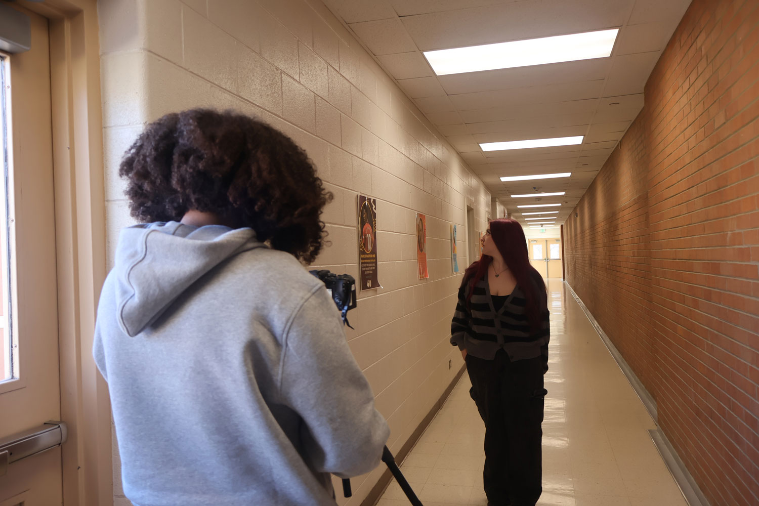 student taking picture of a girl