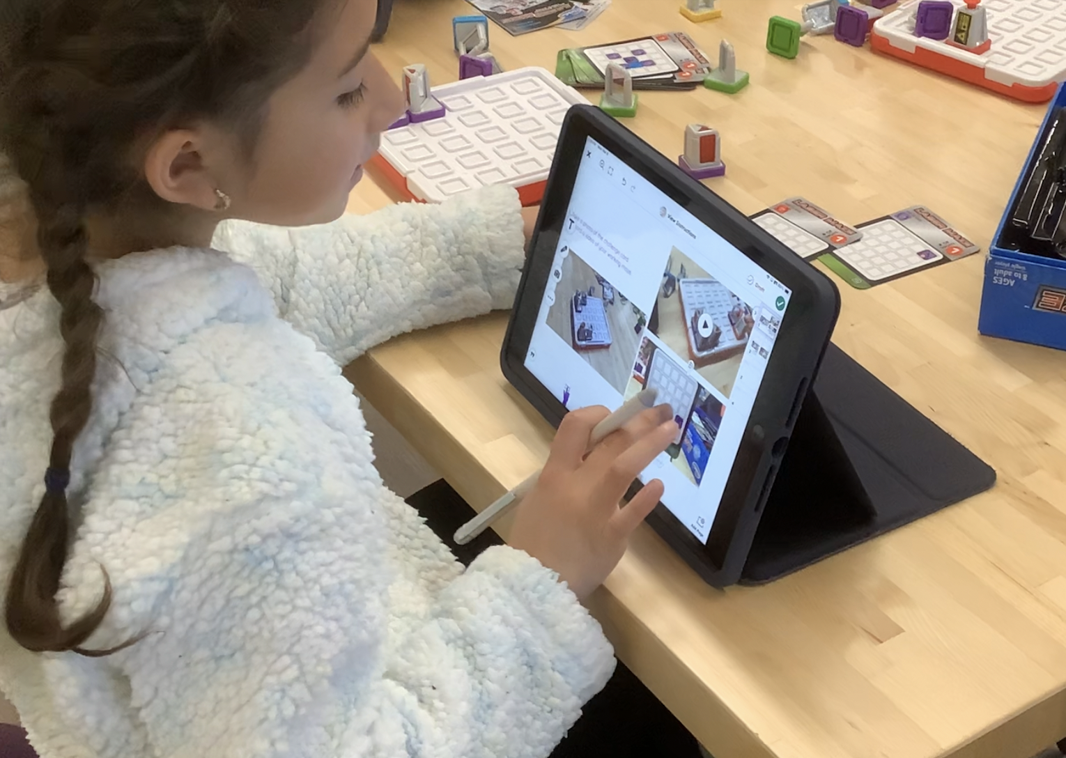 Student using Seesaw on iPad