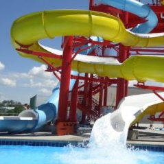 Photo of waterslides at Rexburg Rapids. Two slides total - yellow and blue with red supports