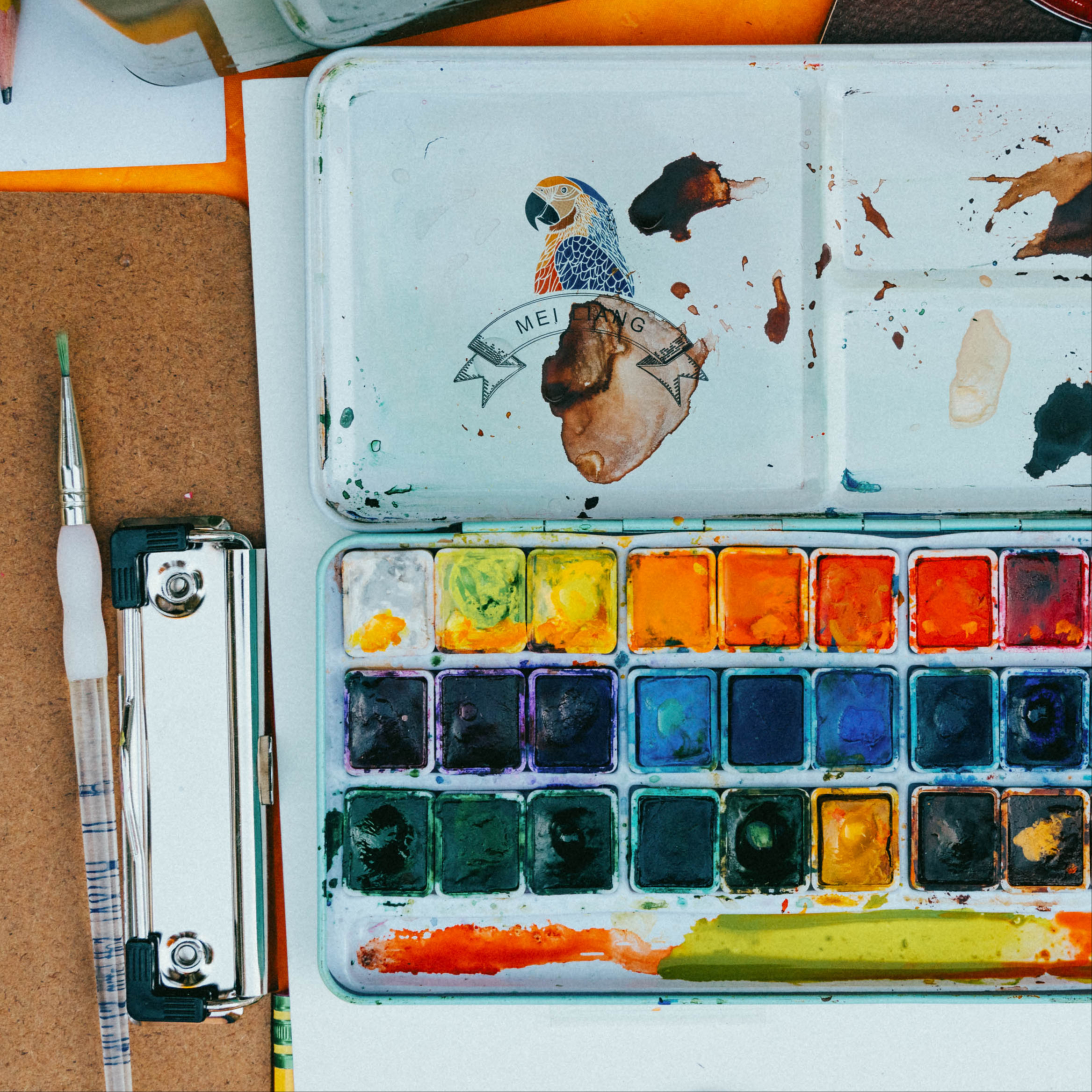 kids painting on a table closeup