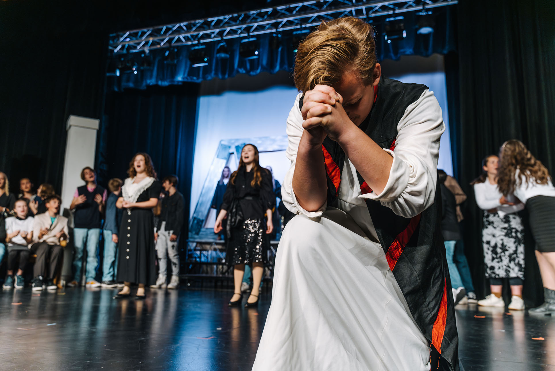 Footloose pastor praying