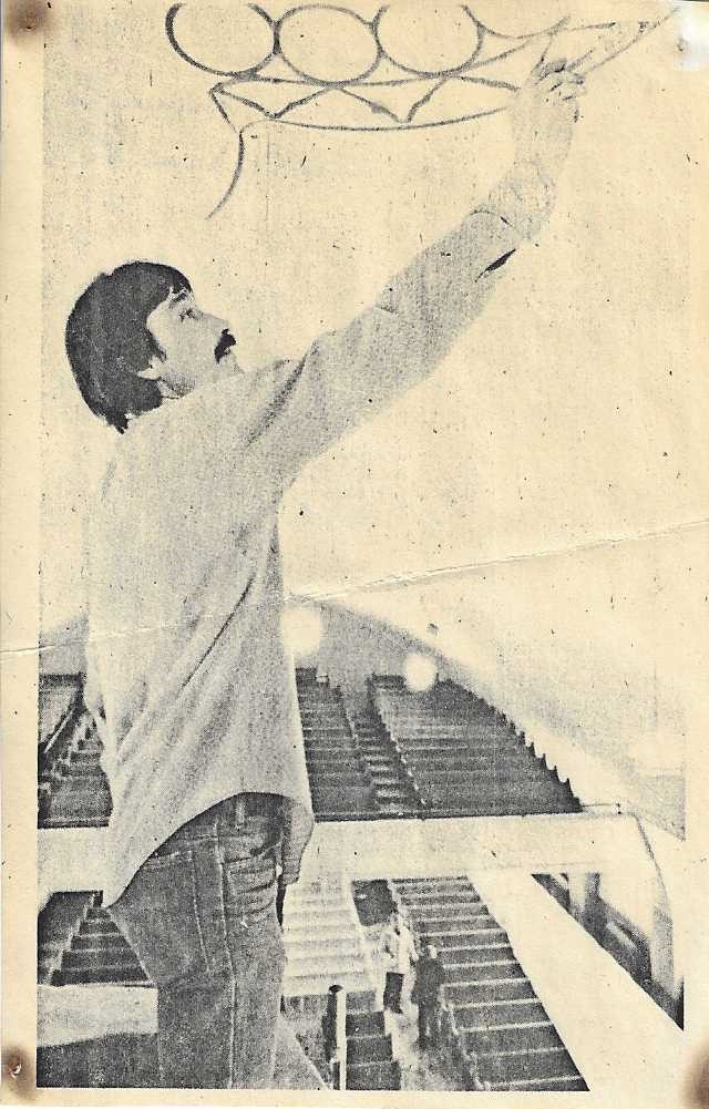 Old sepia photo of Brad Chapple painting the ceiling of the Tabernacle.