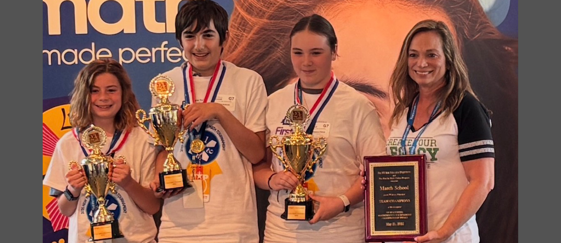 4 students holding their awards