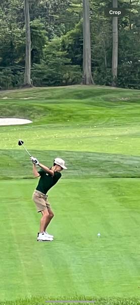 Carle Place student playing golf.