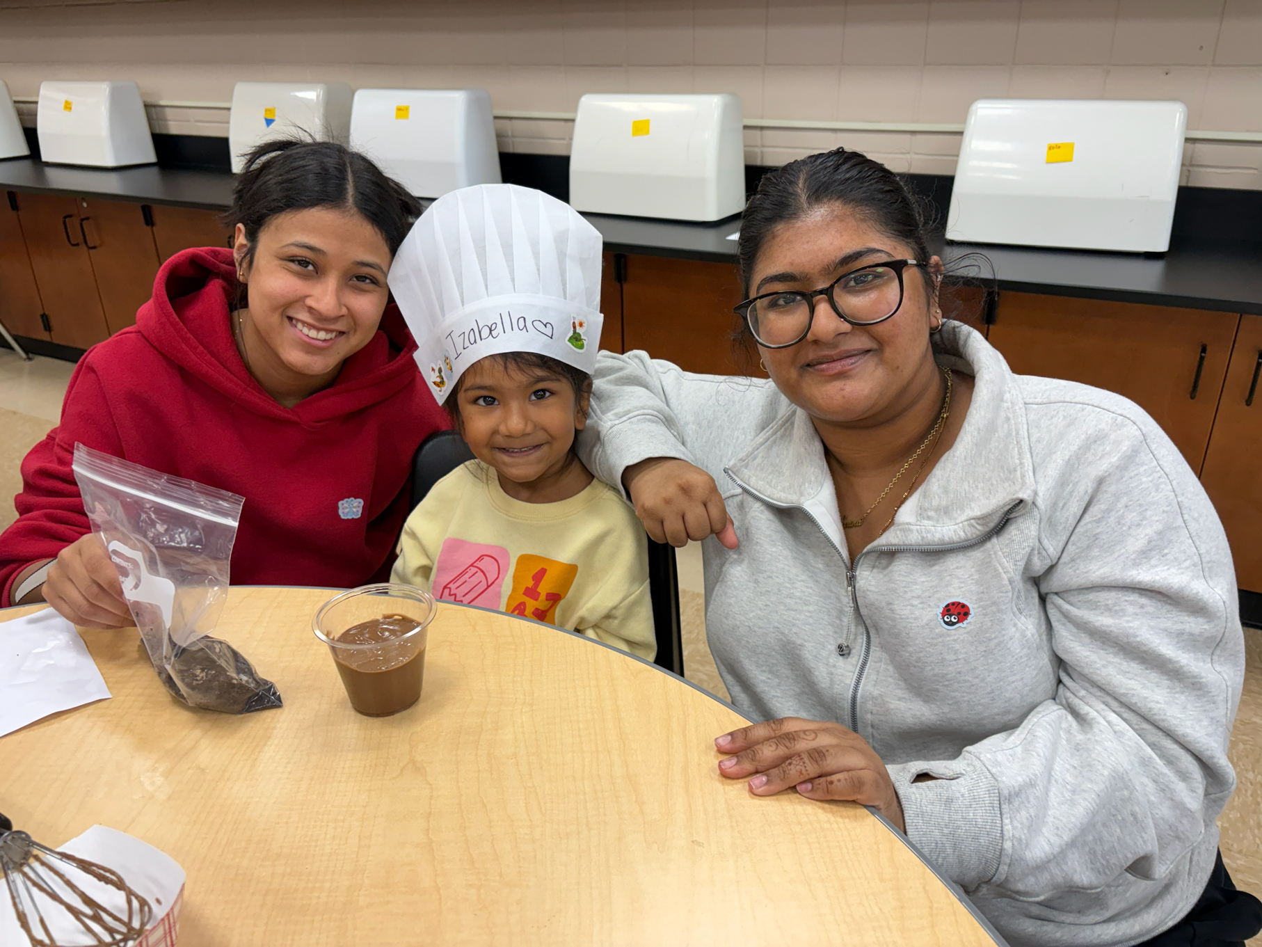 Students sitting at table.