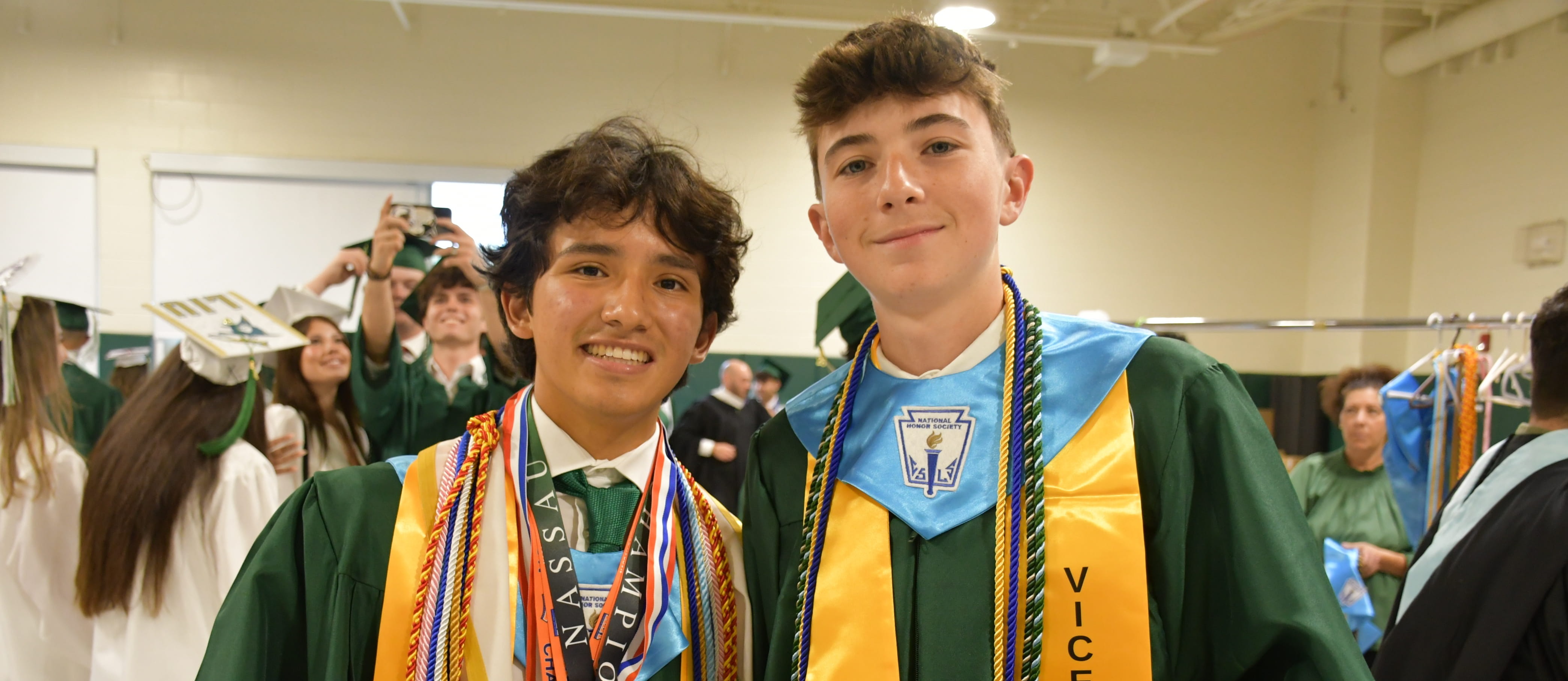Graduating seniors smiling together.