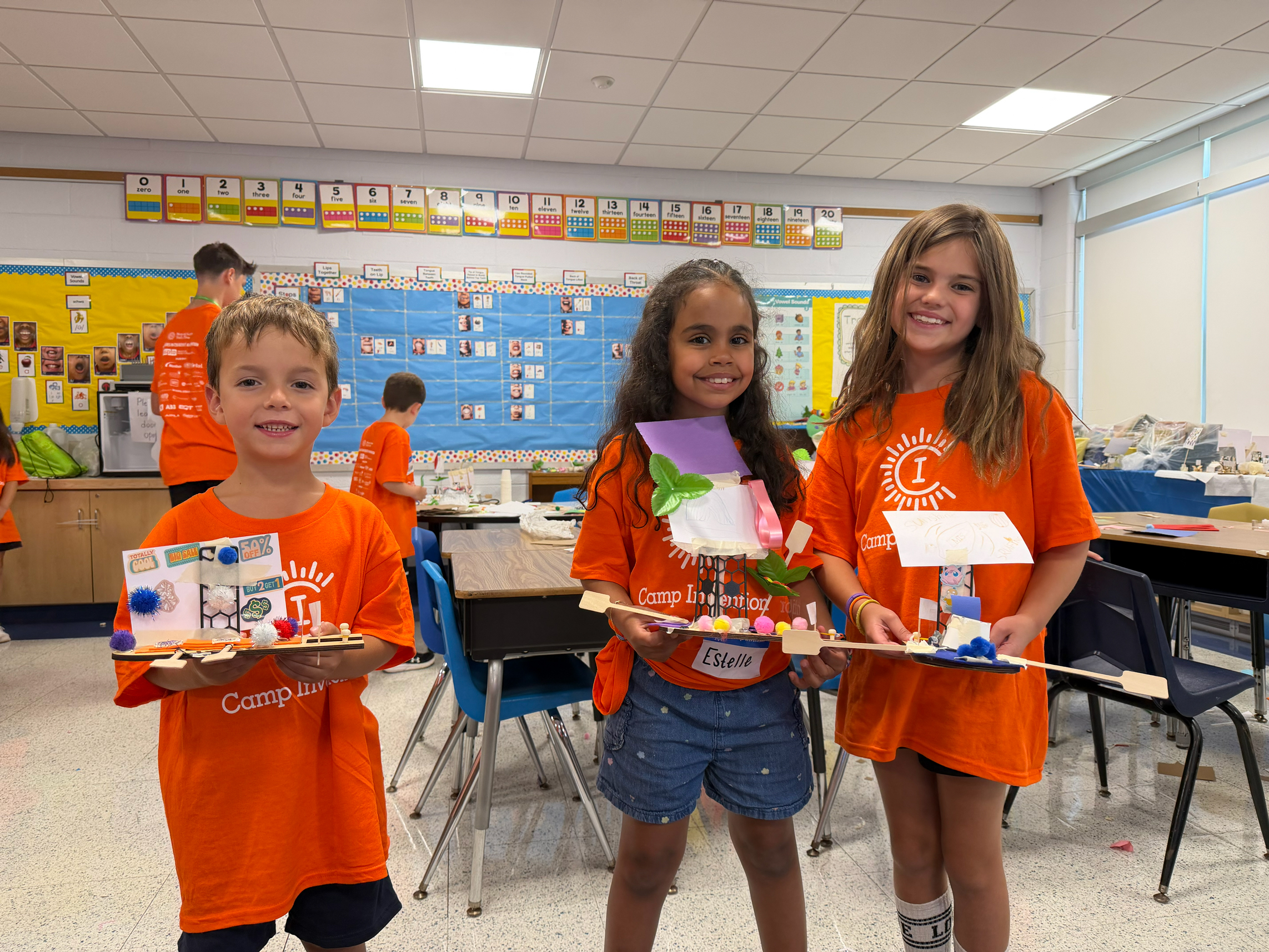 Students holding their projects.