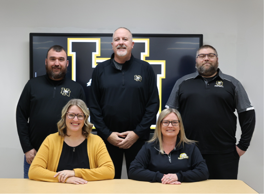 school board members sitting and smiling