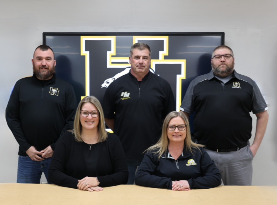 school board members sitting and smiling
