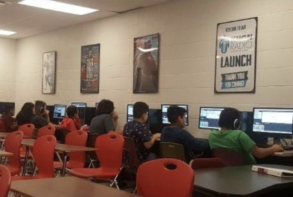 Students looking at computers