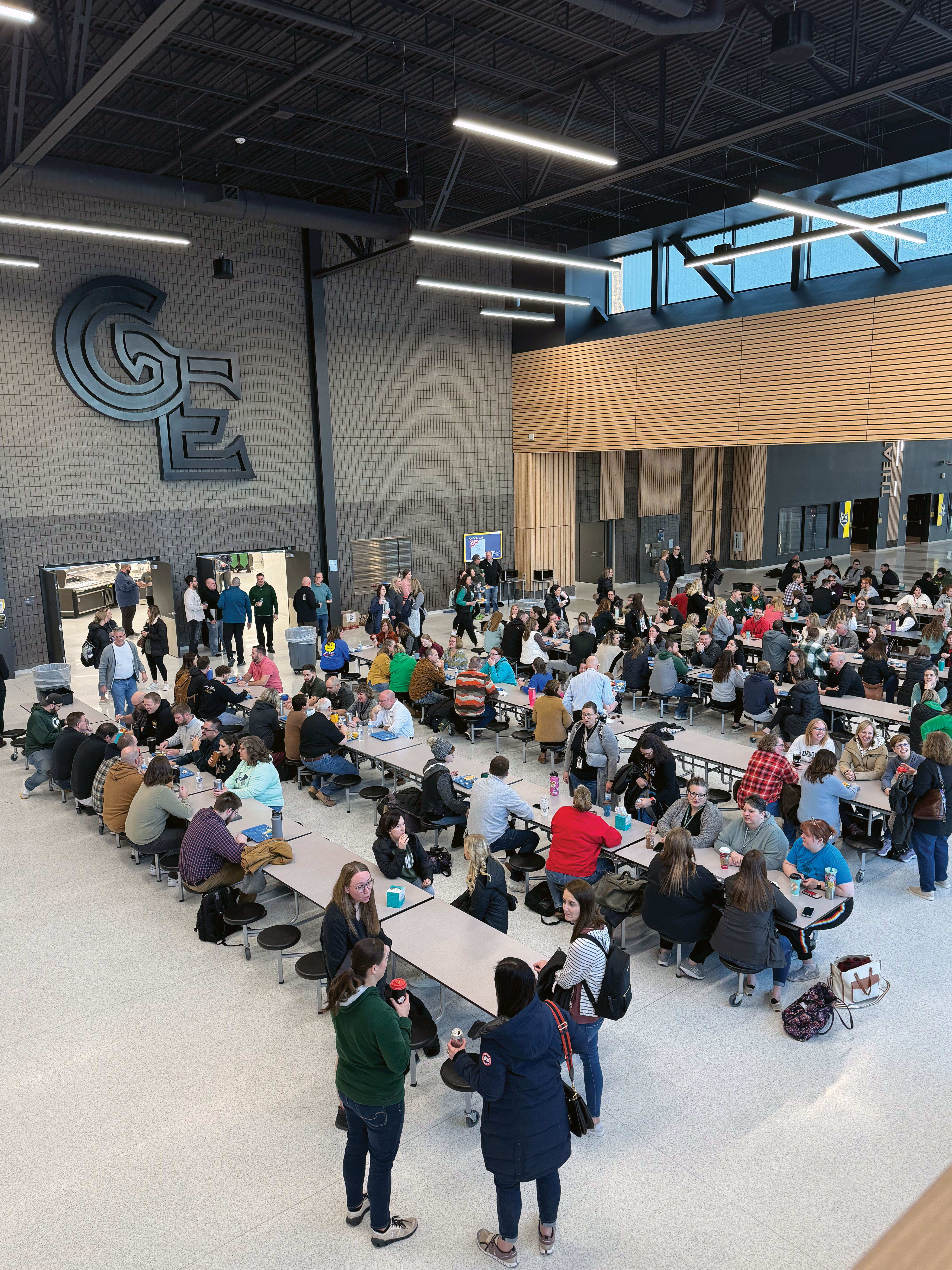 A photo at Gretna East High School cafeteria showing breakfast with all GPS staff.