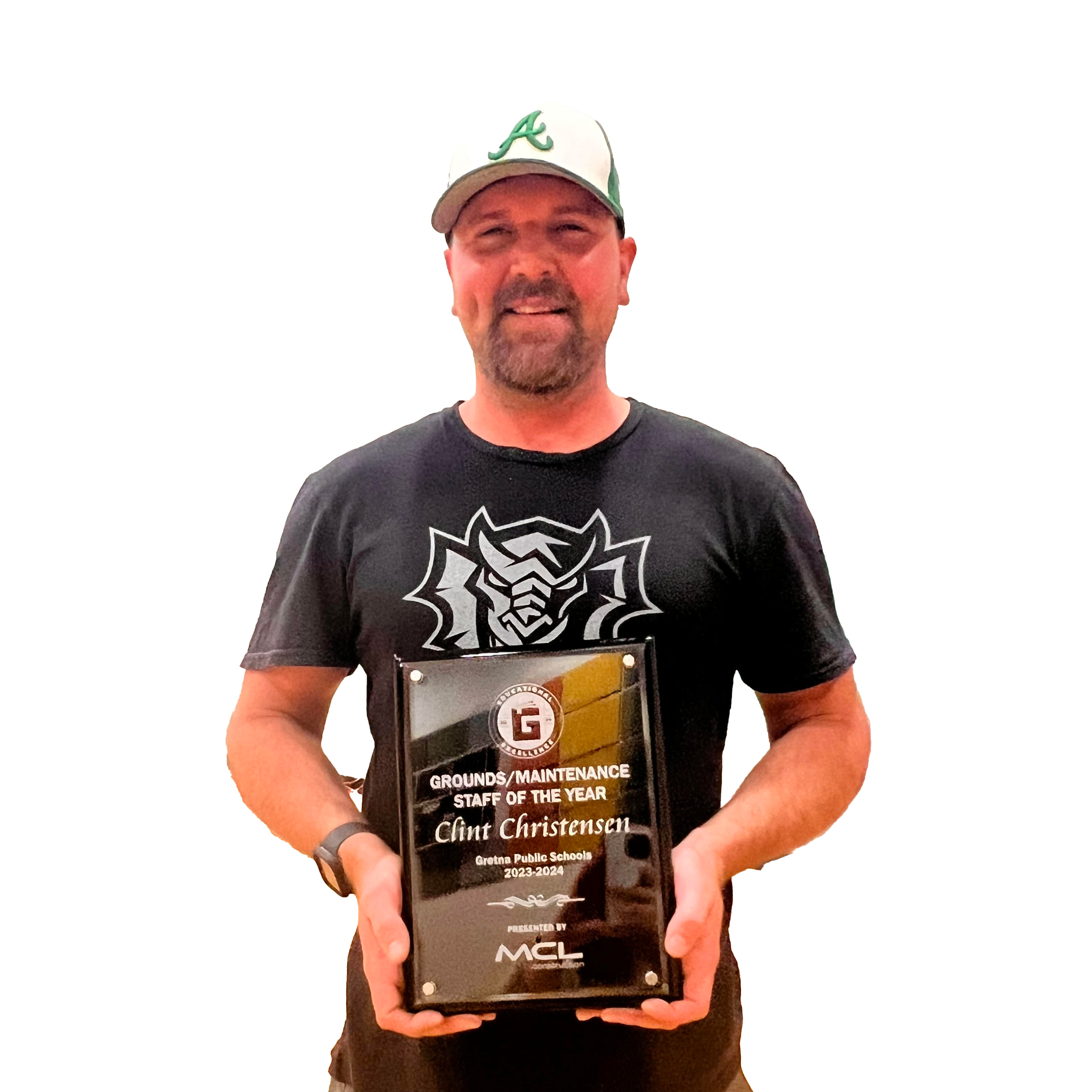 photo of man holding a plaque for Ground/Maintenance staff of the year presented by MCL Construction