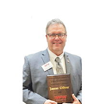 Jim Oliver holding VFW Award