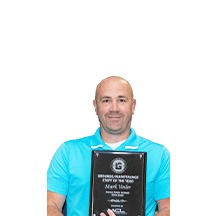 Mark Vosler holding the Education Excellence Award