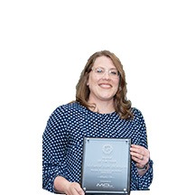 Melanie Van Blarcom receives an award from MCL Construction