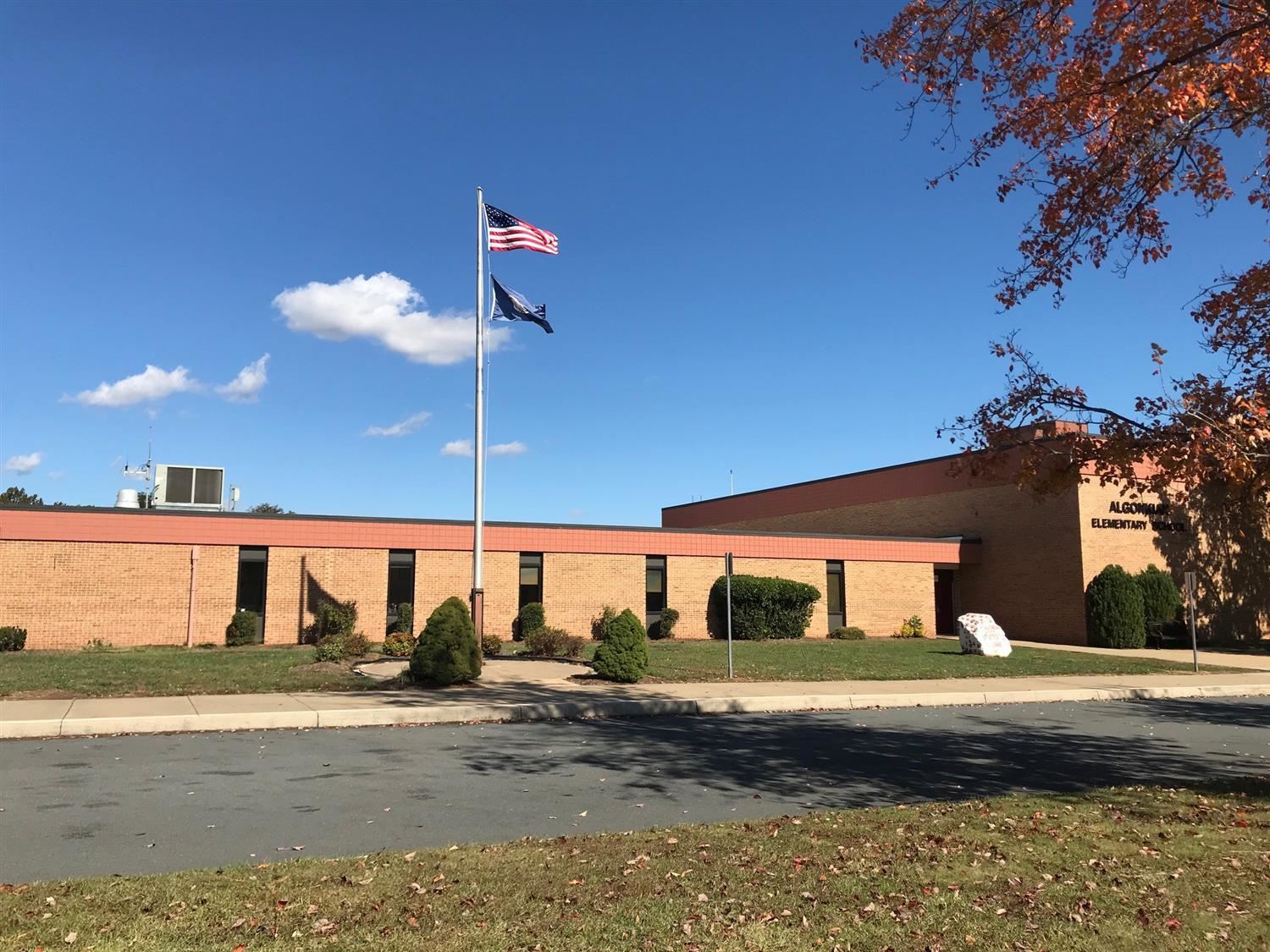 outside algonkian elementary school building with a flag pole in front 