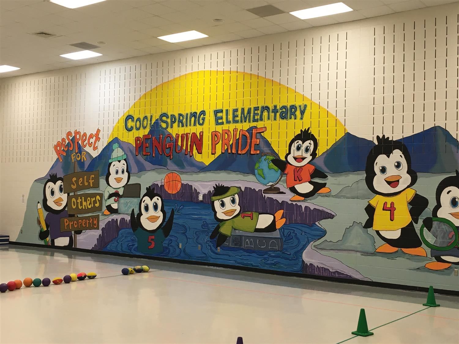 Mural of penguins with the writing Cool Spring Elementary Penguin Pride 
