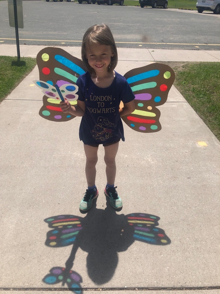 student wearing butterfly wings