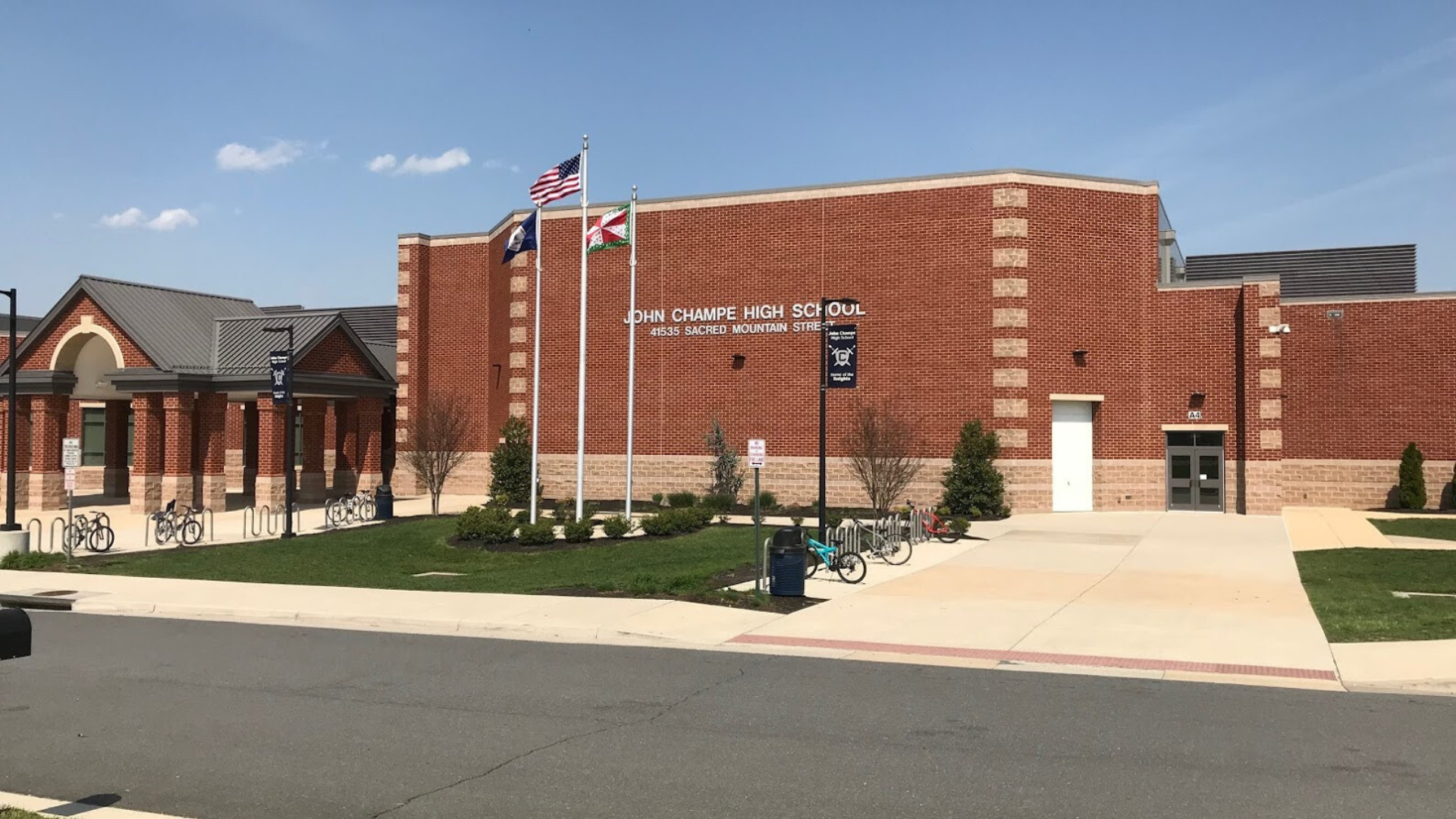 Photograph of the front of the John Champe High School building.
