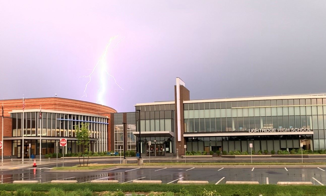 lightening bolt striking behind the school front entrance 