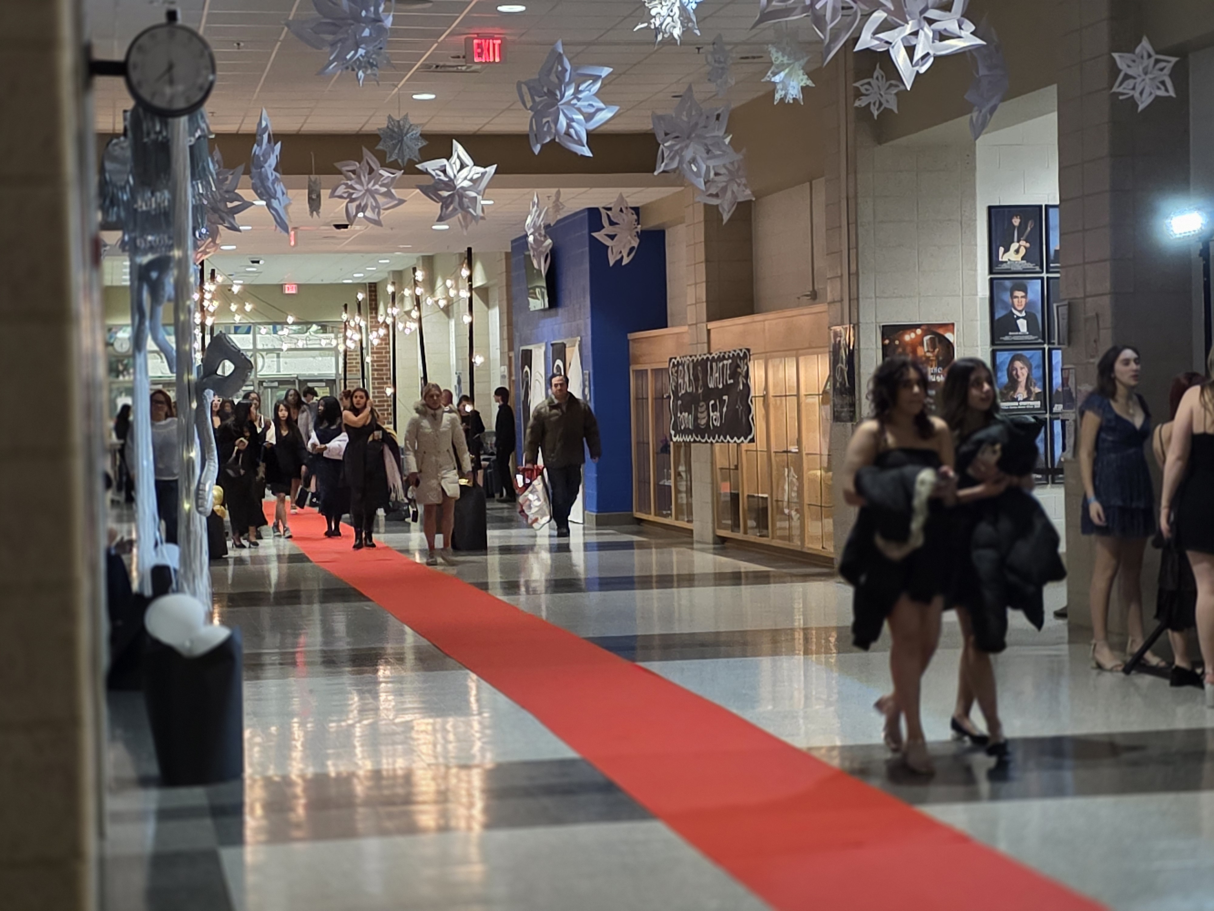 Photo inside the atrium of a high school decorated for a winter formal dance.