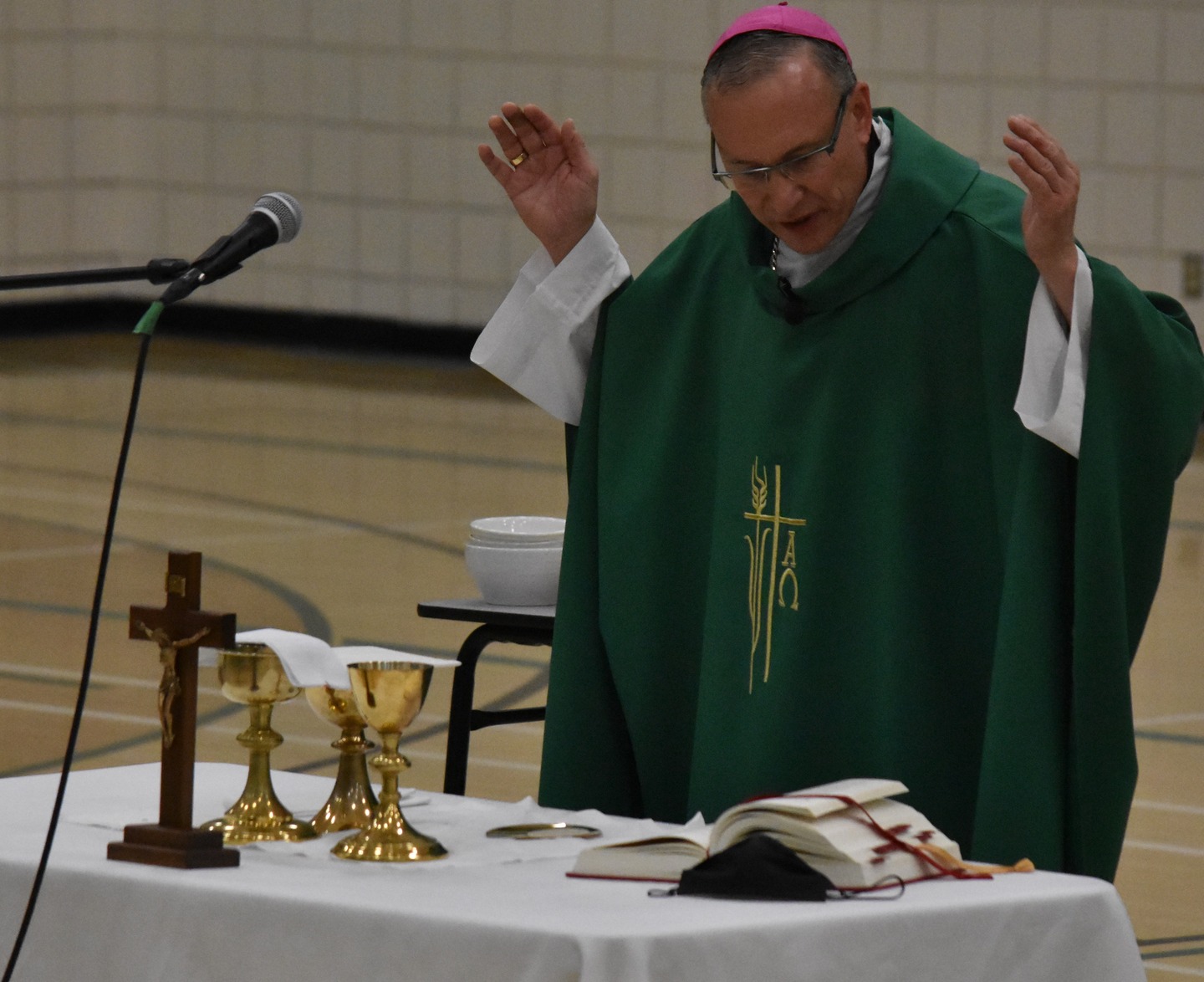 priest giving a talk in a church