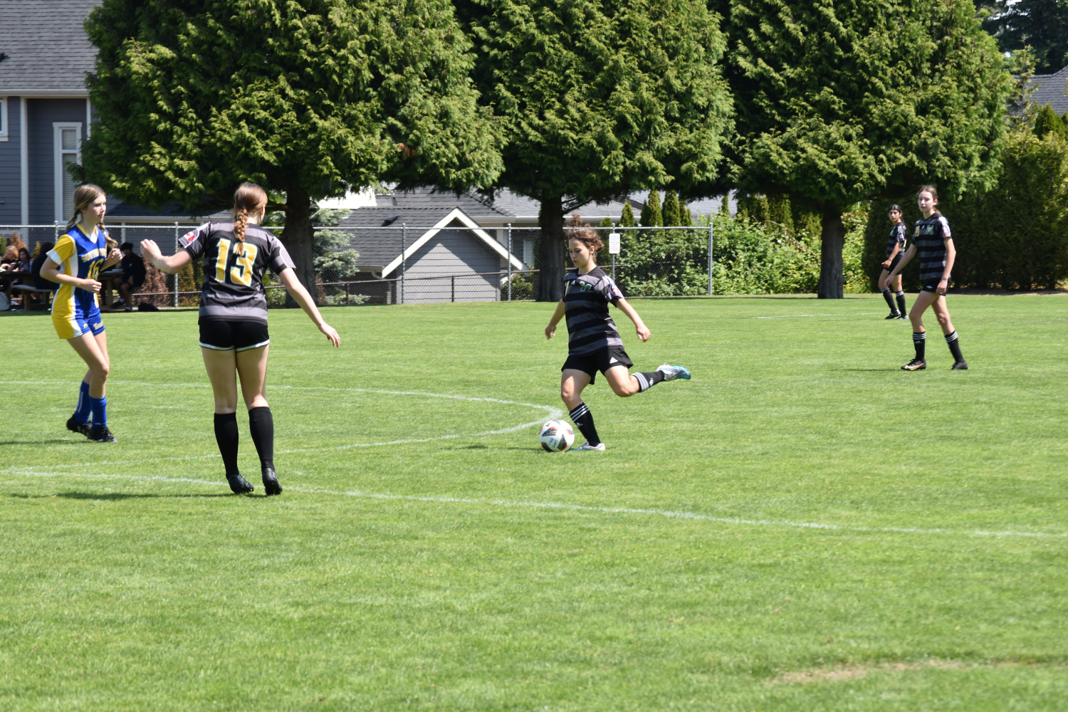 4 girls playing soccer