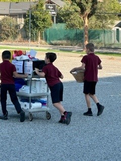 students pushing card with donations