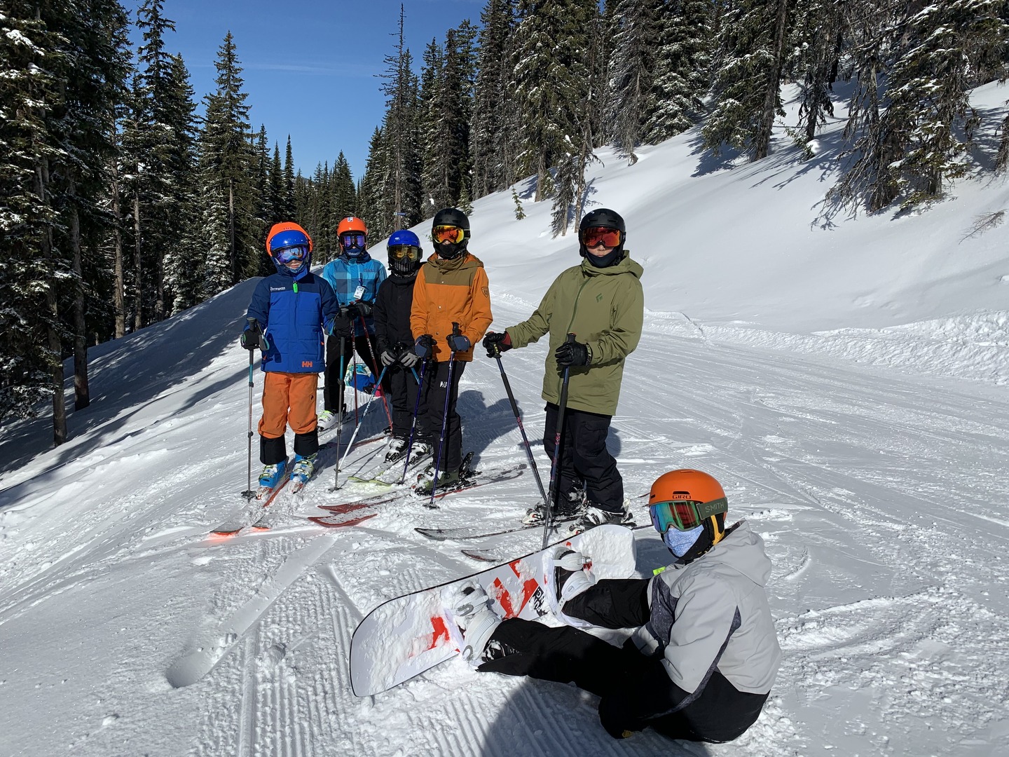 students skiing on a snowed mountain hill