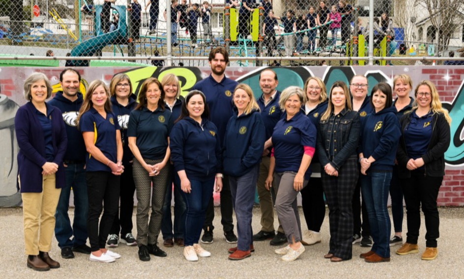 st joseph staff outside next to a play court