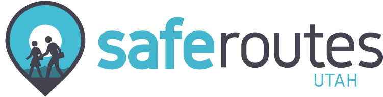 Logo for Safe Routes Utah, featuring a teal location pin icon with silhouettes of an adult and child walking next to the text "safe routes UTAH."