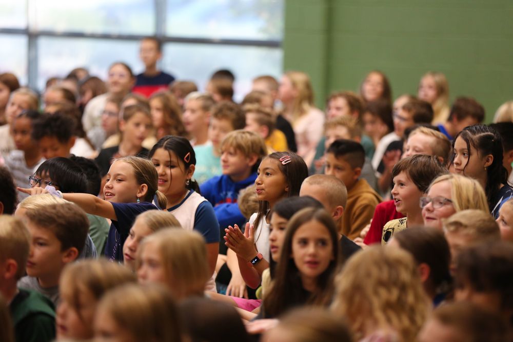 Students in one kind act assembly