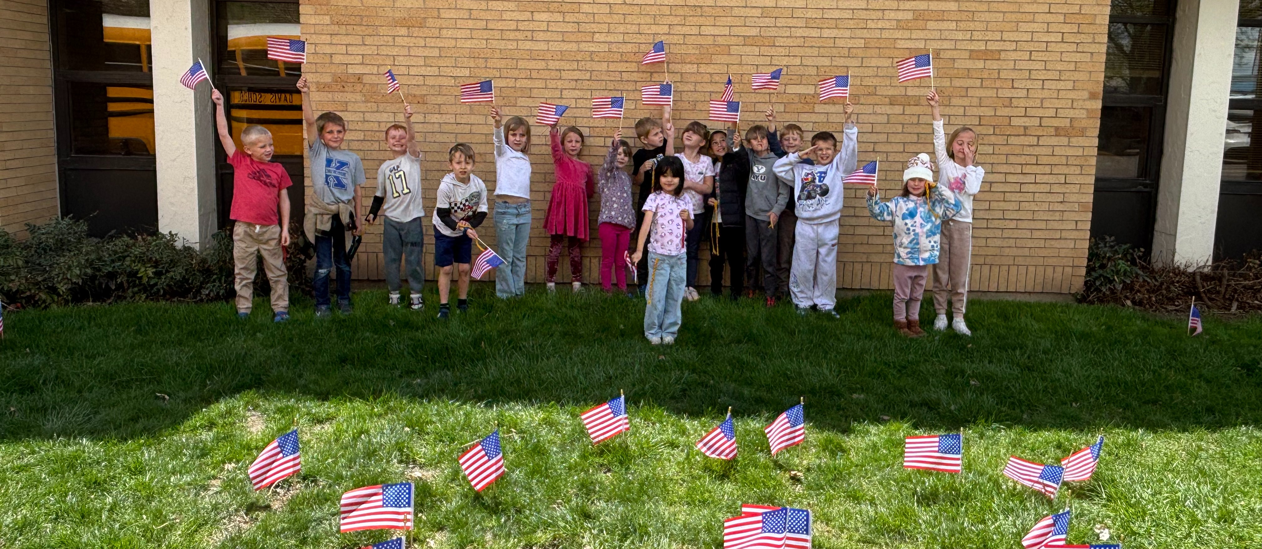 Students waiving flags