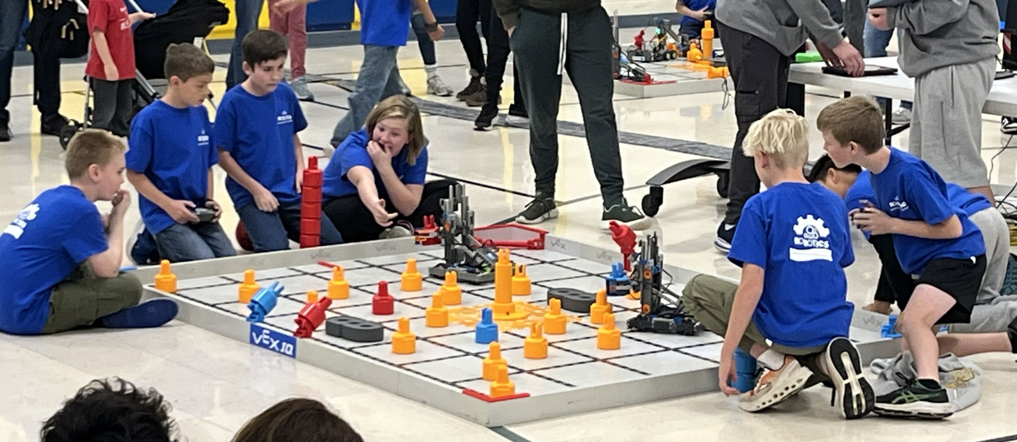 Students at the school robotics compatition in the gym
