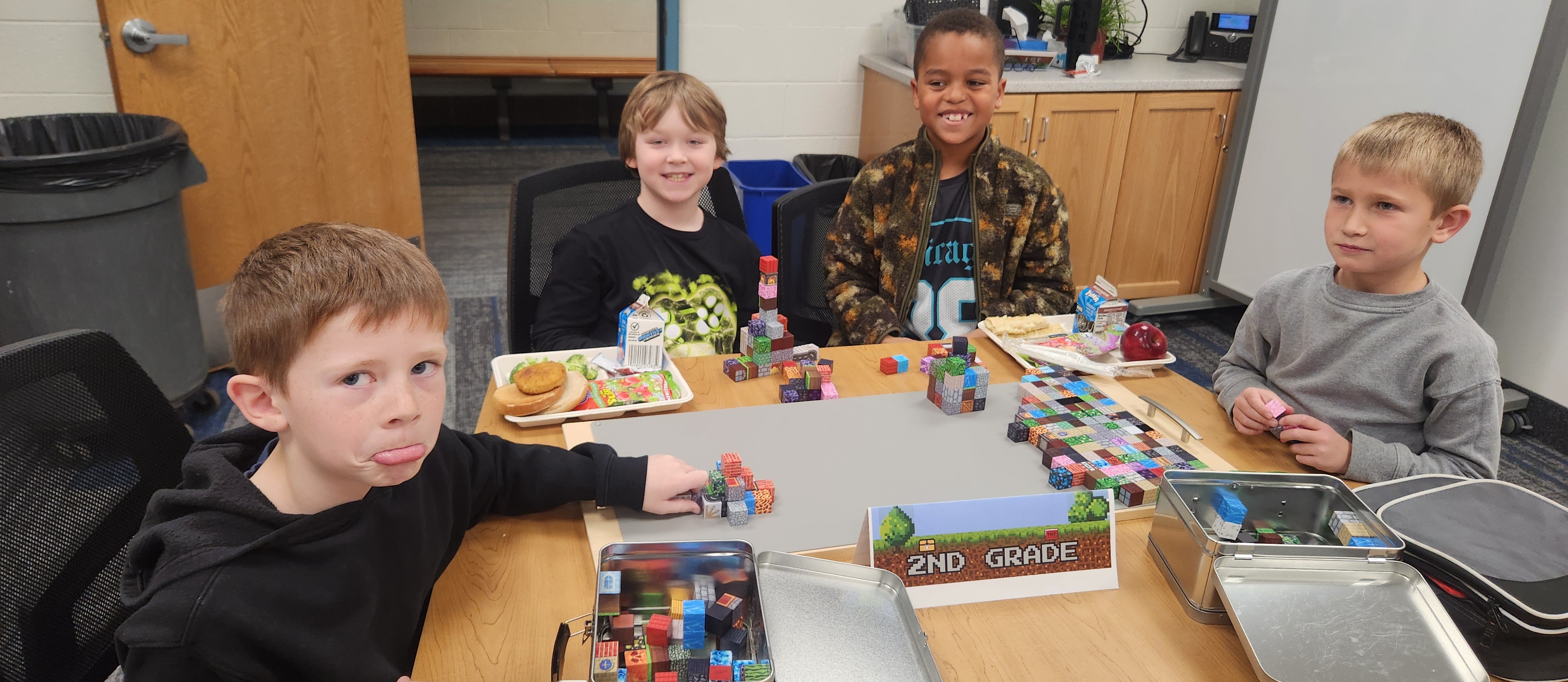 2nd grade students during lunch building with minecraft blocks