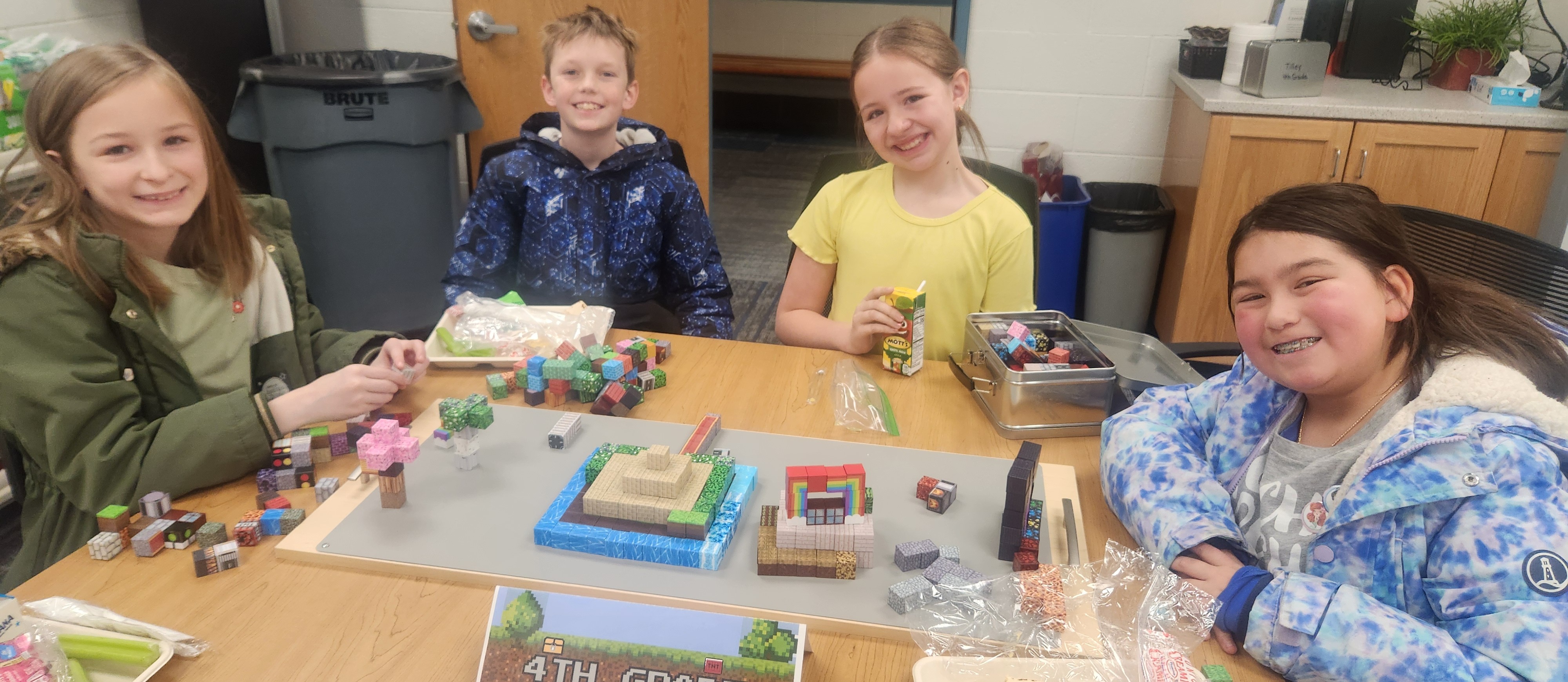 4nd grade students during lunch building with minecraft blocks