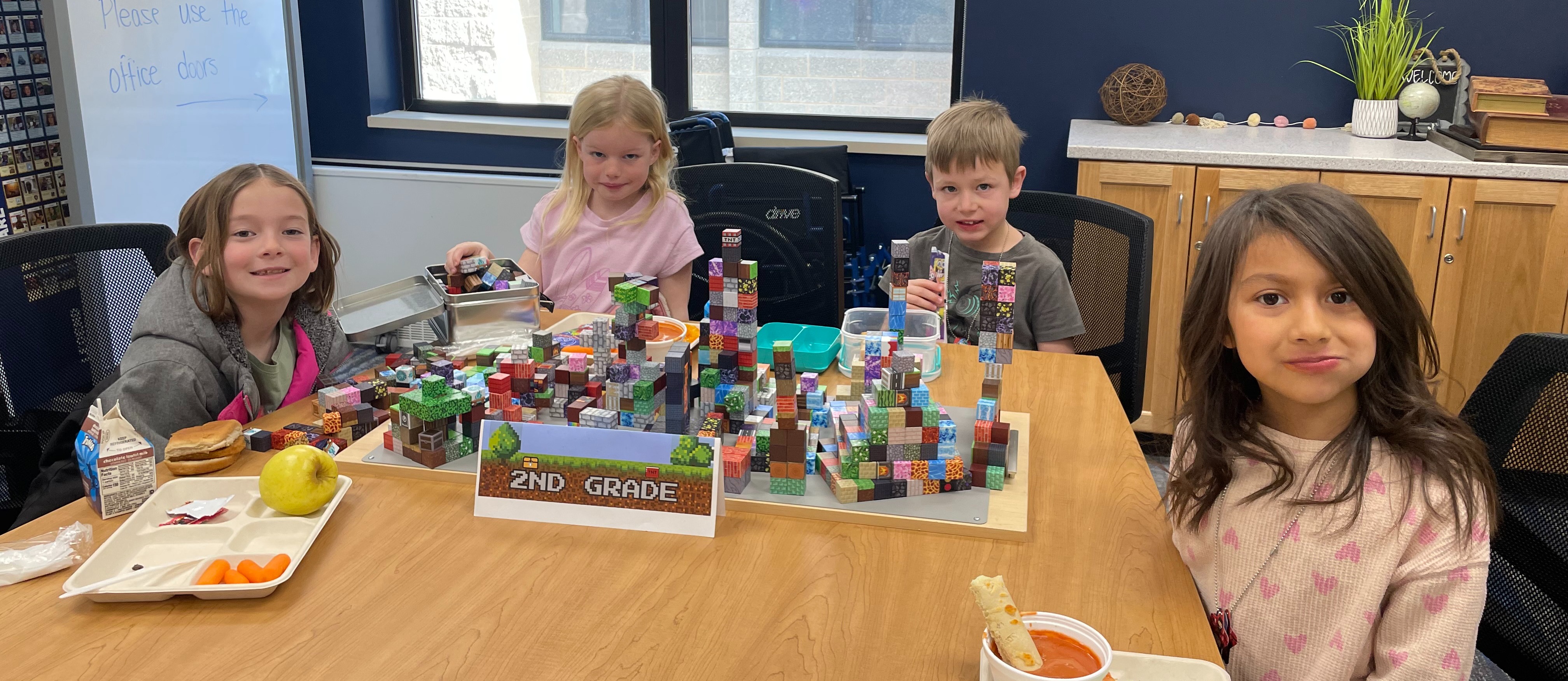 2nd grade students during lunch building with minecraft blocks