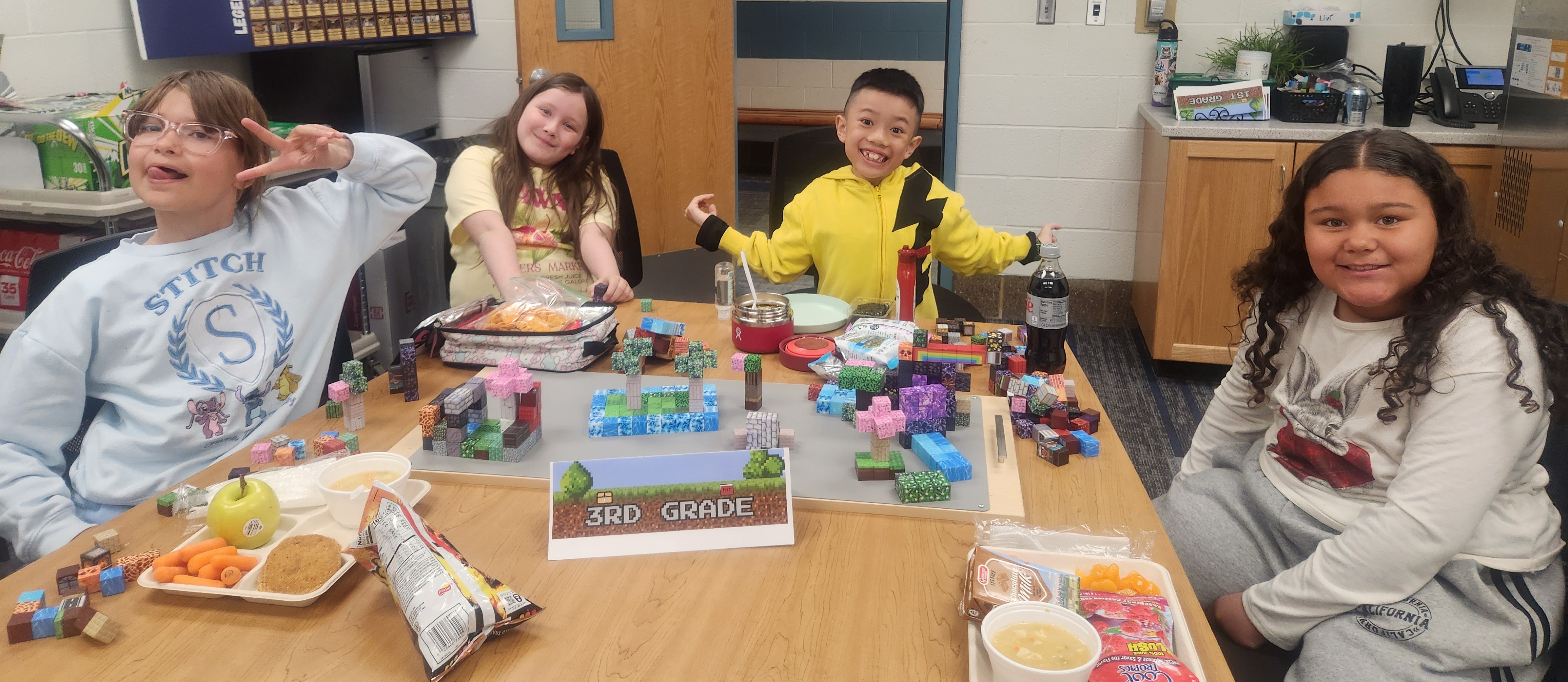3rd grade students during lunch building with minecraft blocks