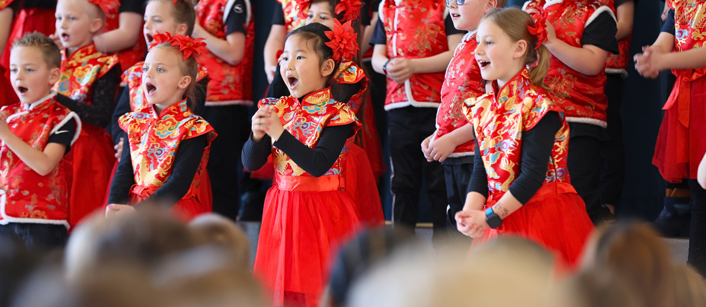 Students singing during Lunar New Year celebration